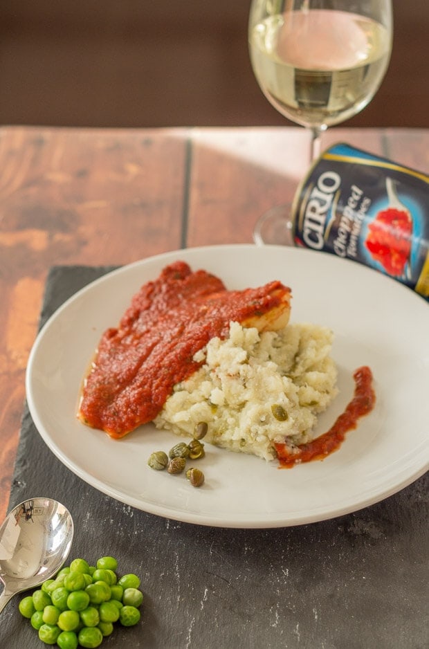 This baked cod with caper mash is a really tasty and easy quick healthy meal. A delicious tomato basil sauce covers the fish which is then baked in the oven and served with a healthy low carb caper mash.