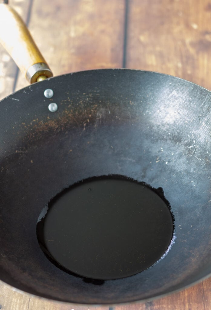 Sesame oil in a wok.