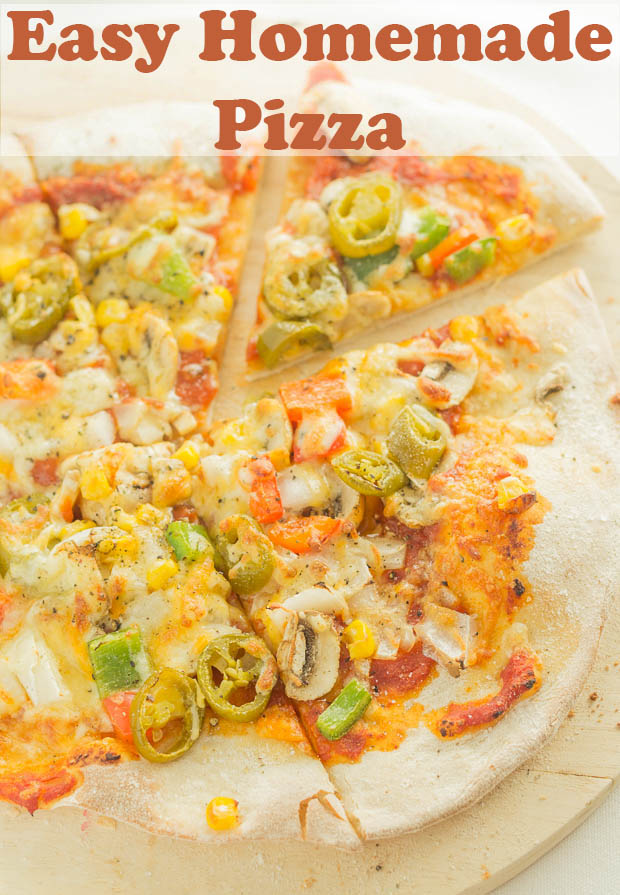 Easy homemade pizza sliced on a pizza board.