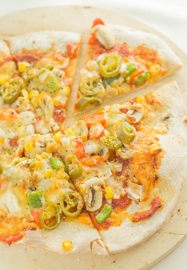 This delicious homemade pizza recipe is easy and great fun to make. With a thin pizza base and a selection of healthy toppings too it proves that pizza doesn't have to be the unhealthy cheese laden calorific dish you get as a takeaway!