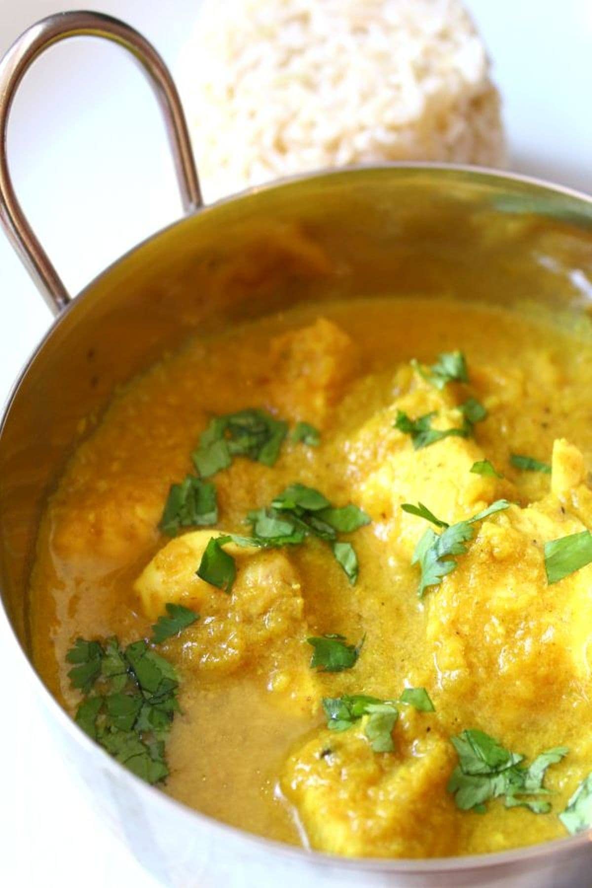 Close up of a balti dish containing lighter chicken korma.