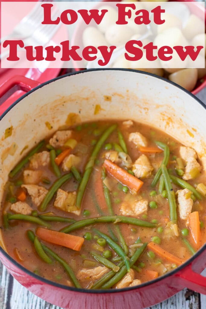 Turkey stew in a large casserole pot. Pin title text overlay at top.