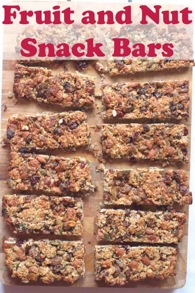 These fruit and nut snack bars are tasty, chewy and crammed full of fruits, nuts and seeds and made with delicious honey. Taking less than an hour to make they make a great healthy snack and energy boost in between meals at only 200 calories each! #neilshealthymeals #recipe #healthy #fruit #nut #snackbars