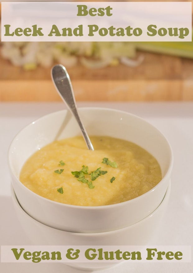 A bowl of leek and potato soup garnished with chopped parsley and with a spoon in. Pin title text overlay at top.