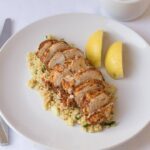 Cajun spiced oven baked chicken is a low cost, lean and tasty quick healthy meal. With a delicious bulgur wheat, tomato and cucumber side salad this recipe makes for an excellent mid-week dinner or lunch option!