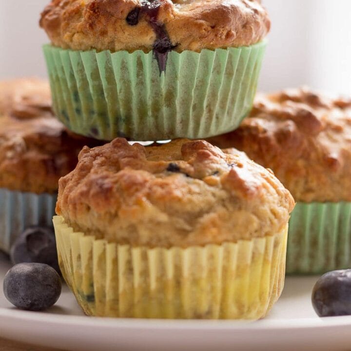 Close up of a plate of banana blueberry breakfast muffins.