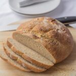 A traditional cob loaf. The perfect mopping up accompaniment for soups and meat and fish stews. If you’ve never made your own bread before then don’t worry, this wholemeal cob loaf is an easy mixed by hand in one bowl bread. No fancy bread machines or machine mixers required, just good old muscle-building hand kneading.