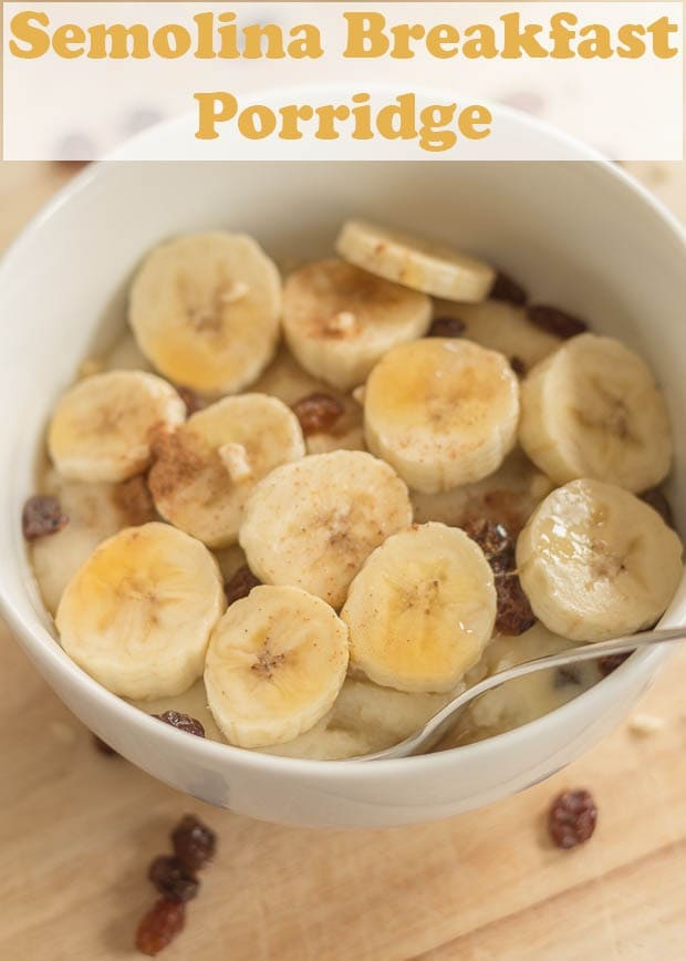 Birds eye view of a bowl of semolina breakfast porridge decorated with sliced bananas.