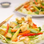 Asian tofu salad is simple and delicious. Sesame marinated tofu with a zingy balsamic soy dressed salad makes for a fantastic and easily prepared vegan quick healthy meal! You'll love the combination of these far eastern flavours and fresh ingredients!