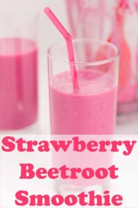 A glass of strawberry beetroot smoothie with a straw in. Another glass and blender jug in the background. Pin title text overlay at bottom.