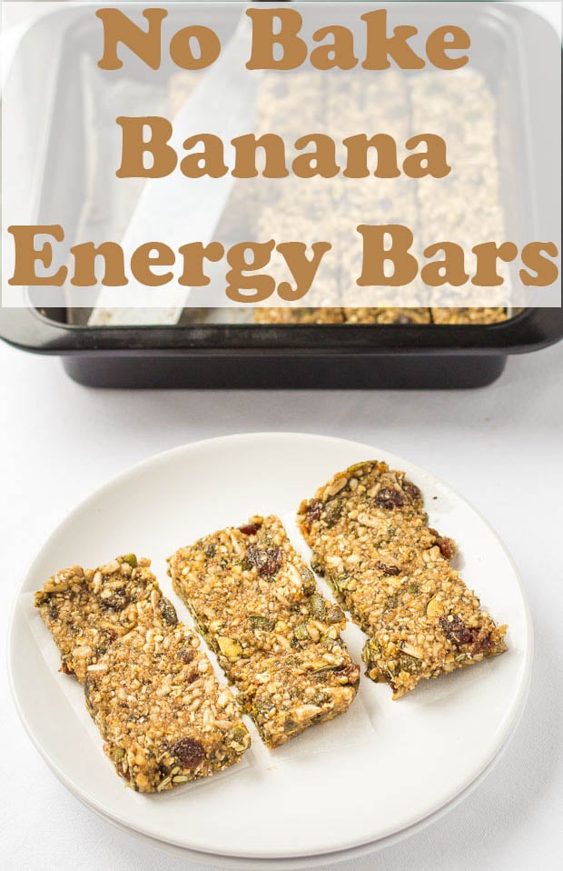 Three no bake banana energy bars on a white plate with the dish they were baked in in the background.