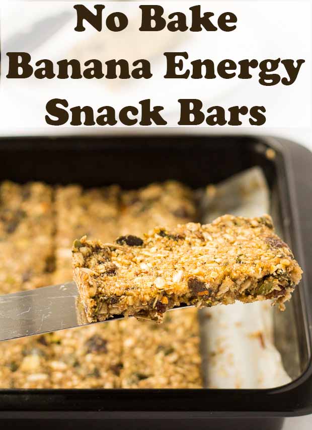 A no bake banana energy bar being lifted out of the baking tray on a spatula. Pin title text overlay at top.