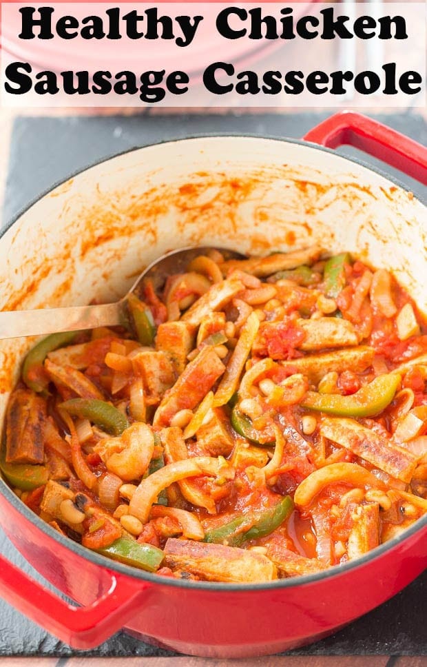 Chicken sausage casserole with a serving spoon in it ready to serve.