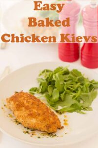 Easy baked chicken kievs served on a plate with rocket salad. Pin title text overlay at top.