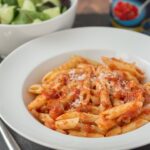 This easy pasta arrabiata recipe is a simple quick healthy meal for four made in less than half an hour. When you're short on time, but still want those classic Mediterranean flavours, this delicious dish will satisfy all those needs with minimal fuss and effort.