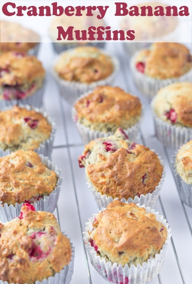 A wire rack with cranberry banana muffins on. Pin title text overlay at top.