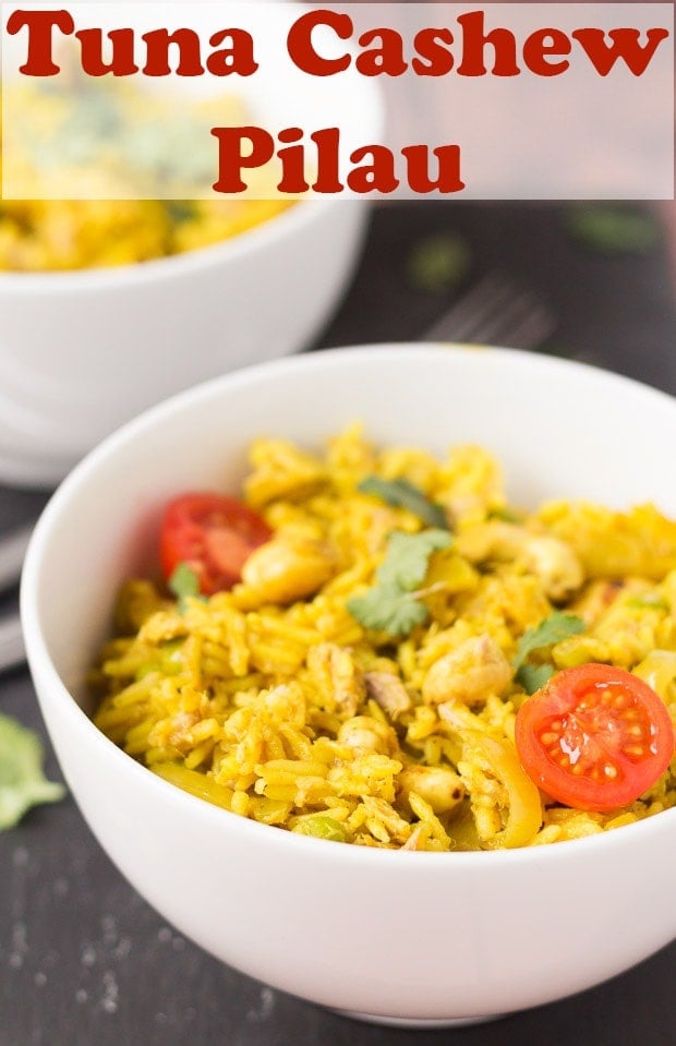 Two bowls of tuna cashew pilau on a black slate. Pin title text overlay at top.