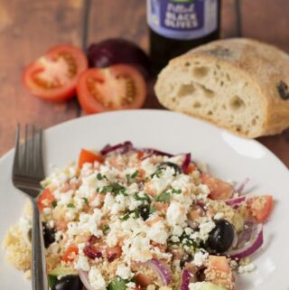 This couscous Greek salad with home-made dressing is a delicious, filling and easy to make summer salad packed with lots of healthy goodness. Made in just 20 minutes!  