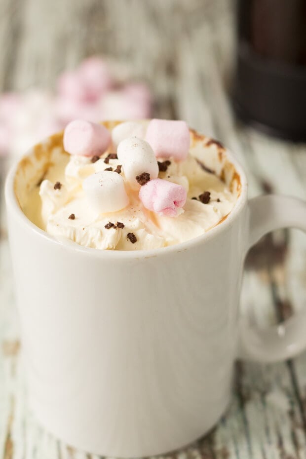 Close up of an Americano coffee mug cake decorated with marshmallows.
