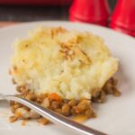 This vegan green lentil shepherd's pie is a comforting and delicious recipe. Topped with a creamy tasting cauliflower mash it's so full of flavour it'll soon become a family favourite!
