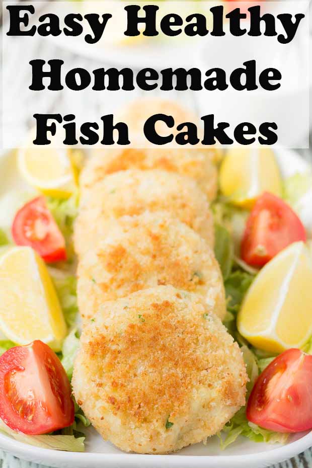 Rectangle dish of 4 quick healthy fish cakes on a bed of iceberg lettuce served with sliced lemons and tomatoes.