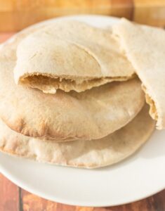 Homemade whole grain pita bread is a healthier version of the classic pocket bread. A staple of the Middle East this is an easy recipe that everyone can make at home. Delicious with hummus or stuffed with your favourite filling!