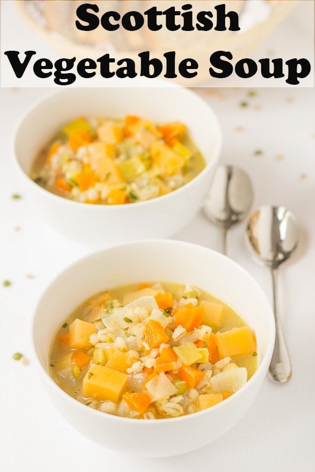Two bowls of Scottish vegetable soup with soup spoons to the right hand side. Pin title text overlay at top.