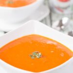 Tomato and chorizo soup is the perfect winter warmer. Vibrant and bursting with flavour, this easy low cost rustic soup is just what you need when it's cold outside.