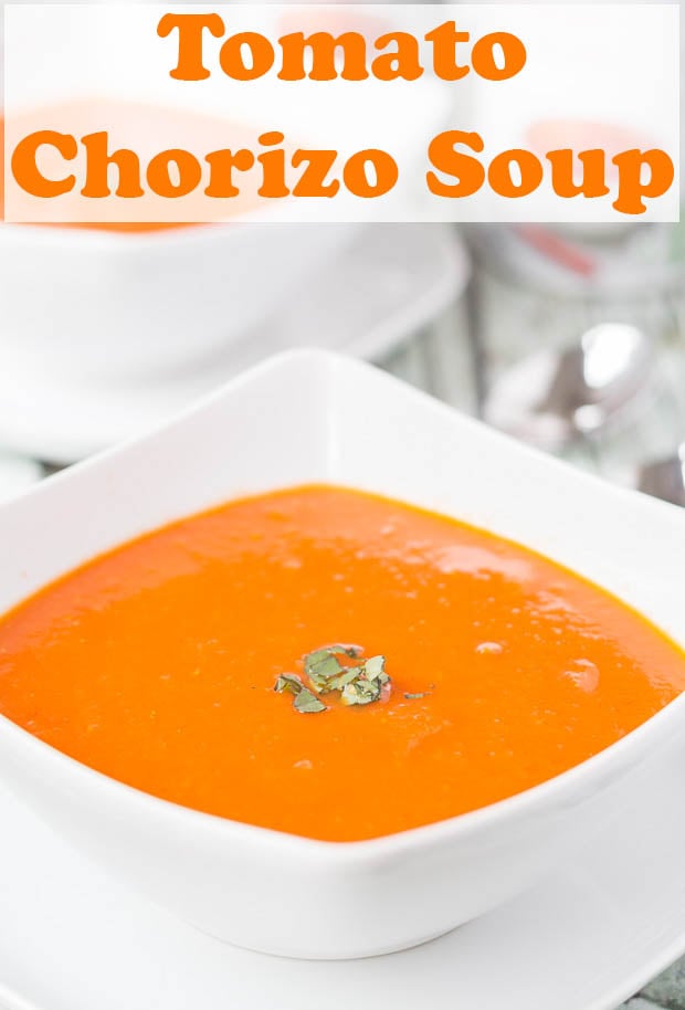 Two bowls of tomato and chorizo soup one in front of the other.