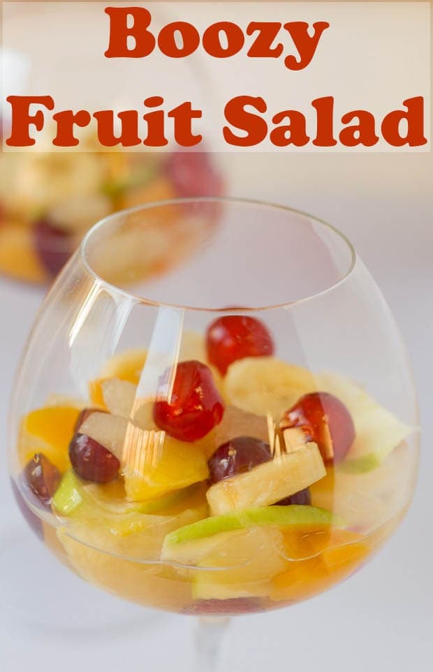 A glass of boozy fruit salad ready to eat.