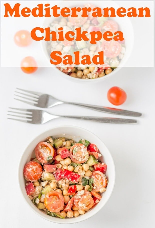 Birds eye view of a bowl of Mediterranean chickpea salad with two forks beside. Pin title text overlay at top.