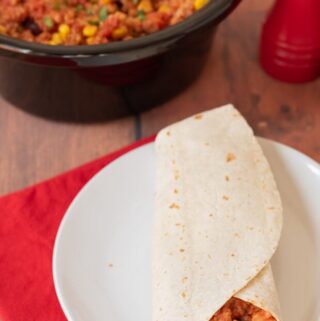 Slow cooker budget bean burritos are the perfect recipe for feeding the family and letting you get on with other things in the meantime. Delicious and full of flavor just add all the ingredients into your cooker and let it simmer away resulting in a cheap and easy healthy, vegan meal!