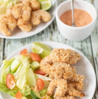 This healthy baked coconut prawns with dipping sauce recipe is great for sharing with friends, can be served as an appetiser, or it could even be a main family meal too. Quick and simple to make and with no frying involved this versatile tasty recipe is also budget friendly!
