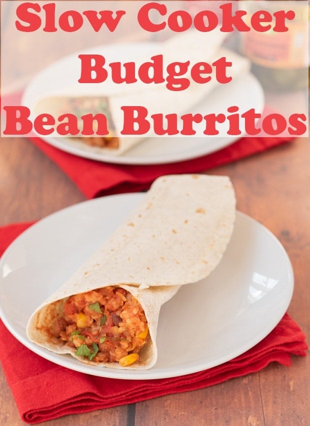 Two plates with slow cooker budget bean burritos on. Red napkins underneath. Pin title text overlay at top.