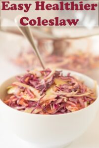 A bowl of easy healthier coleslaw with a serving spoon in. Pin title text overlay at top.