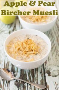 Two bowls of apple and pear bircher muesli with a spoon in front. Pin title text overlay at top.