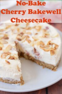 Close up of a no bake cherry bakewell cheesecake on a plate with a slice removed. Pin title text overlay at top.
