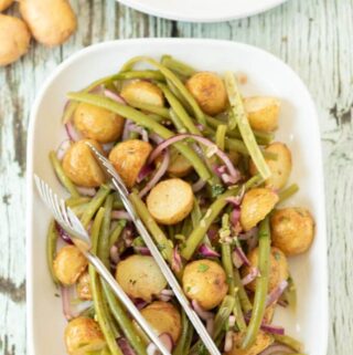 Roast potato and green bean salad is a simple and delicious salad. It can be served warm or as a side to go with your favourite main dish. It's also a great way of using up any leftover roast potatoes. It makes a great flavoursome packed lunch too!