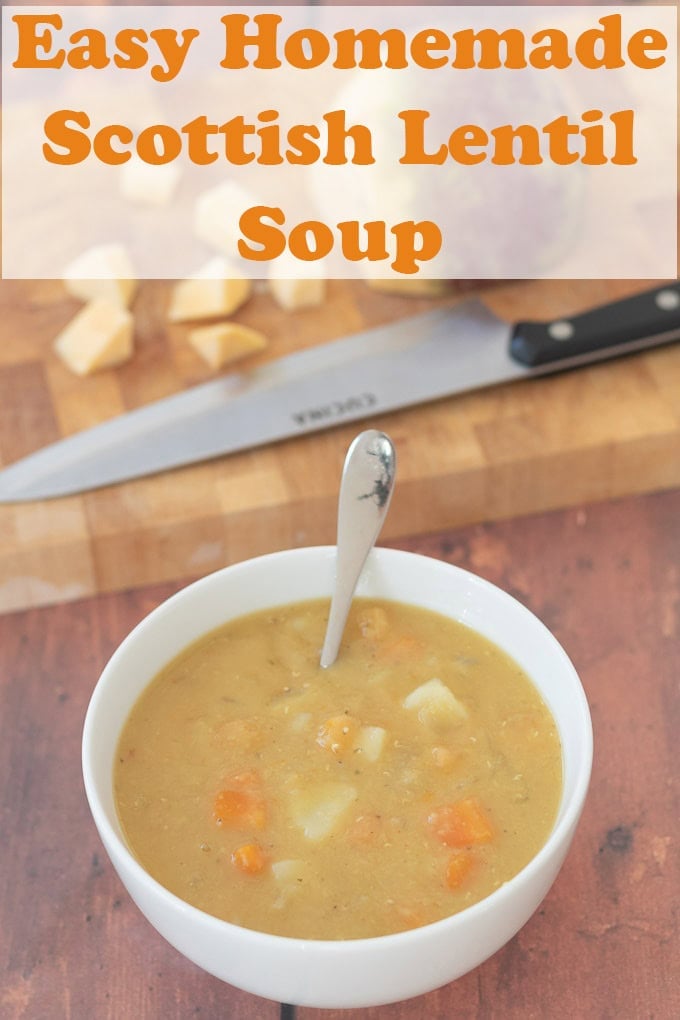 A bowl of homemade easy Scottish lentil soup with a soup spoon in. Above a chopping knife and vegetables on a cutting board. Pin title text overlay at top.