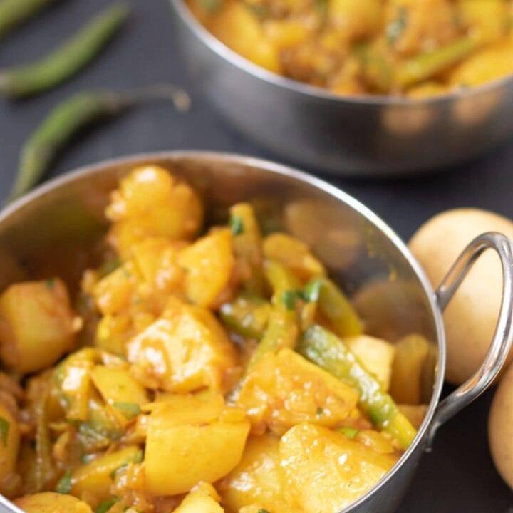 40 minute potato curry served in two balti curry dishes ready to eat.