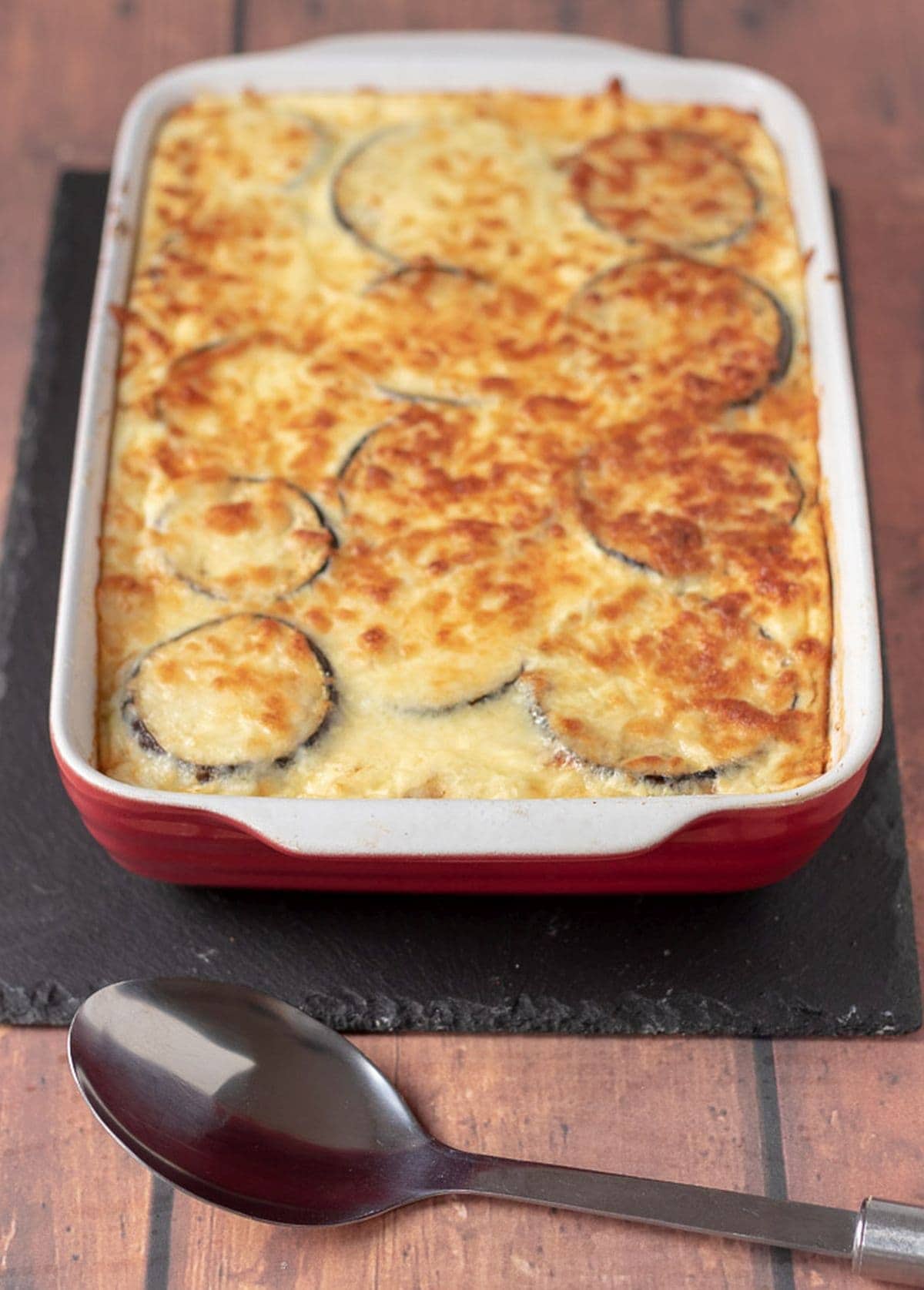 Delicious healthier Moussaka just taken out of the oven and cooling before being carved up and served.