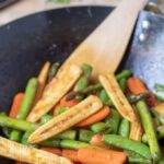 Picture showing this delicious healthy spring stir-fry vegetables recipe finished cooking in a wok and ready to serve.