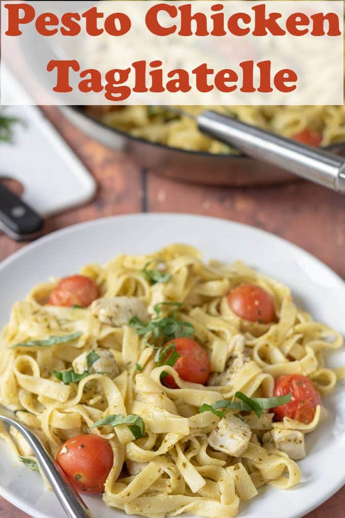 A plate of pesto chicken tagliatelle with the serving pan in the background.