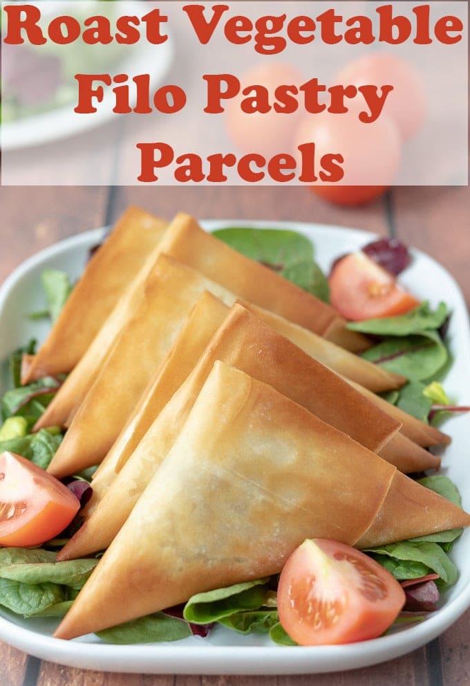 A platter of roast vegetable filo parcels with salad. Pin title text overlay at top.
