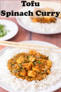 A plate of tofu spinach curry served on a bed of rice with chopsticks. Pin title text overlay at top.