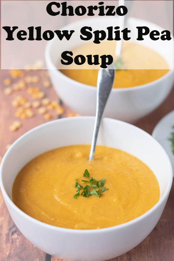 Two bowls of chorizo yellow split pea soup one in front of the other.