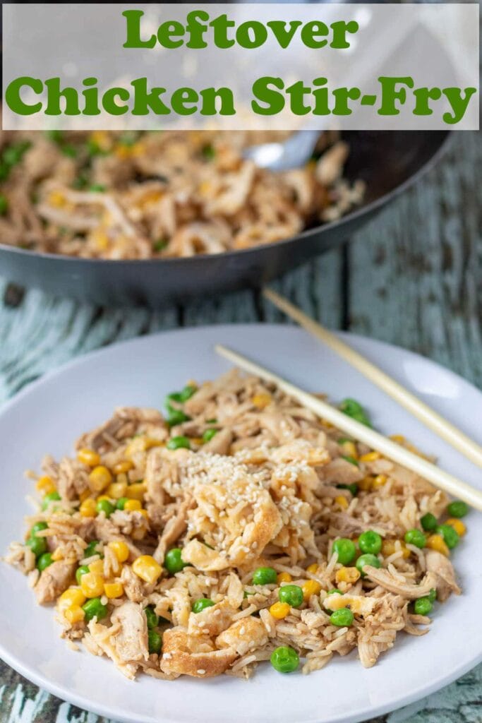 A plate of leftover chicken stir-fry with chopsticks to the side and the wok in the bakcground. Pin Title at the top.