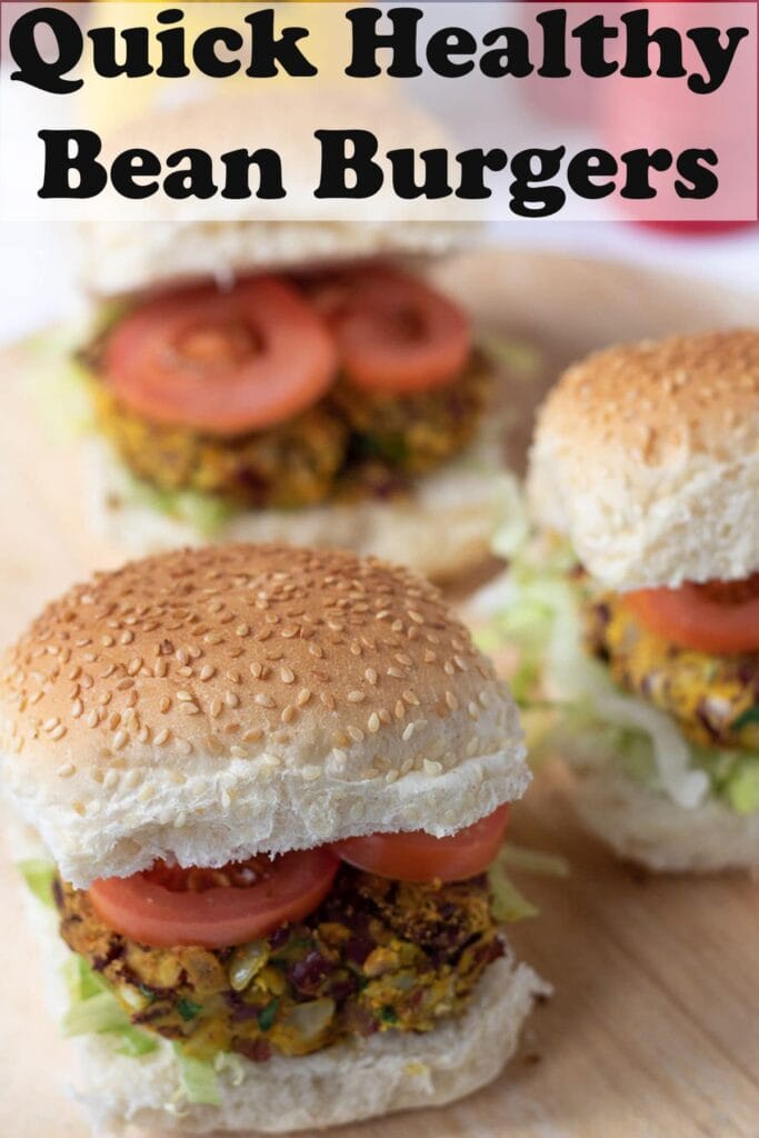 Three quick healthy kidney bean burgers in burger buns on a beds of iceberg lettuce and topped with sliced tomatoes. Pin title text overlay at top.