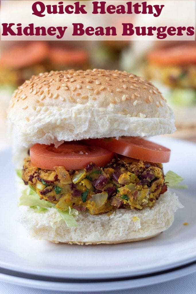 A quick healthy kidney bean burger on a bun with sliced tomatoes. Pin title text overlay at top.