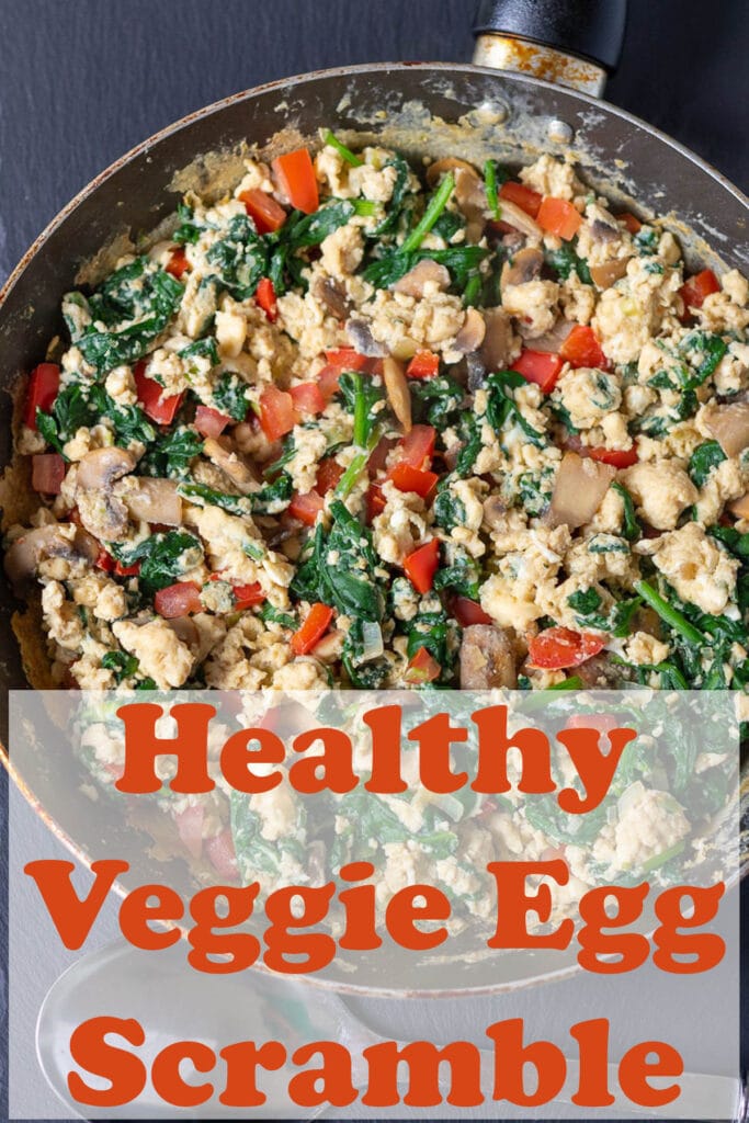 Birds eye view of a pan of cooked healthy vegetable scrambled eggs.